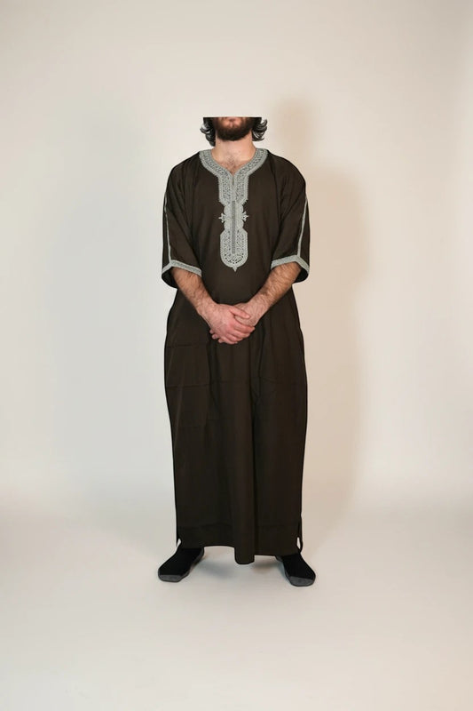 Khayr Thobes dark brown kaftan thobe with silver embroidery on neckline and cuffs, relaxed fit, side pockets.