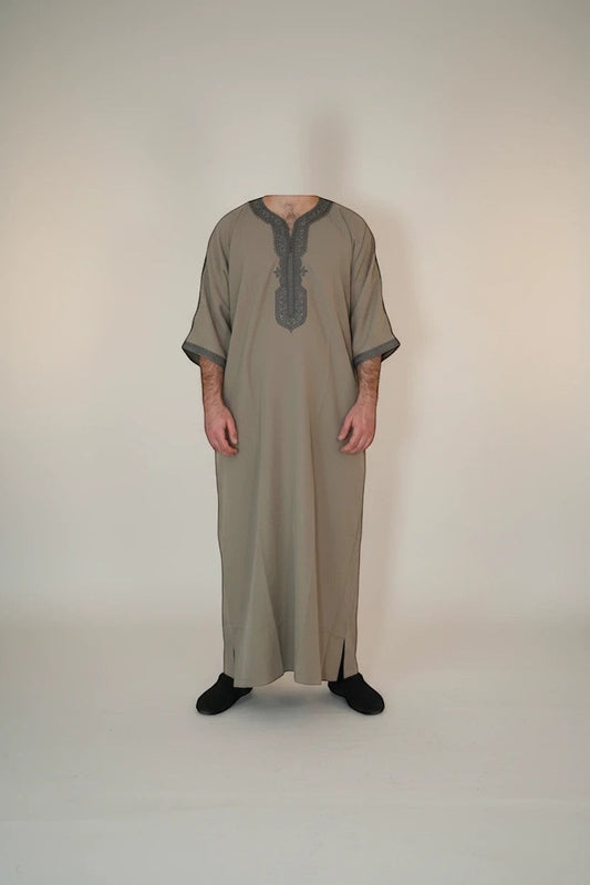 Khayr Thobes men's traditional thobe in neutral tone with grey embroidery on neckline and cuffs.