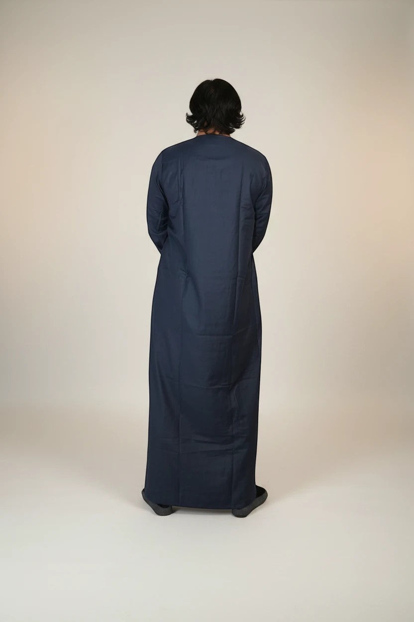 Khayr Thobes Men's traditional long sleeve thobe in deep navy, crafted from breathable fabric with a refined neckline and tassel detail.