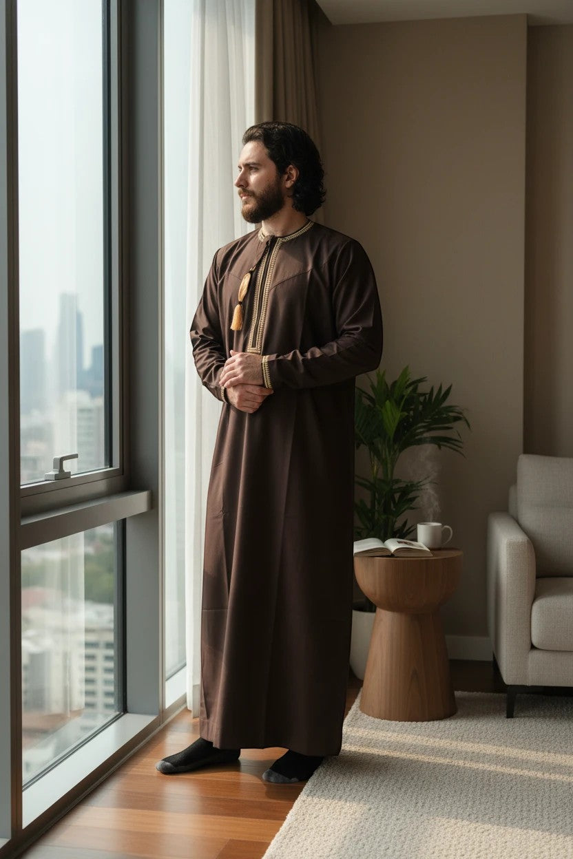 Khayr Thobes men's brown thobe jubba with gold embroidery and tassels. Long sleeves, full length.