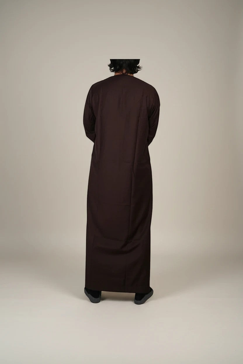 Khayr Thobes men's traditional brown thobe jubba with gold embroidery and tassels. Long sleeves, full length.