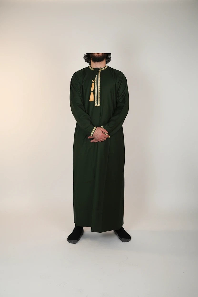 Khayr Thobes dark green thobe with gold and cream embroidery on neckline and cuffs, and tassel detail.