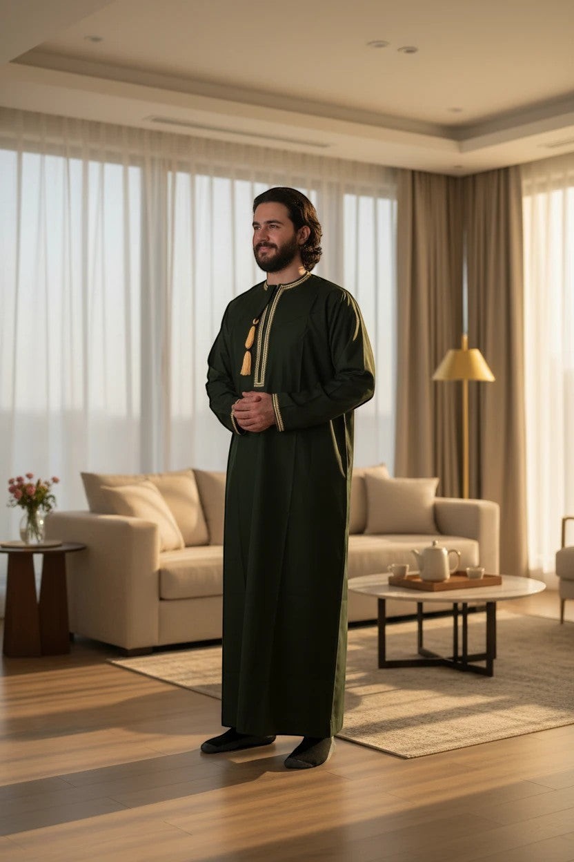 Khayr Thobes dark green thobe with gold and cream embroidery on neckline and cuffs, tassel detail.