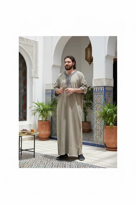 Khayr Thobes men's light grey traditional embroidered thobe, relaxed fit, floor length, detailed neckline and cuffs.