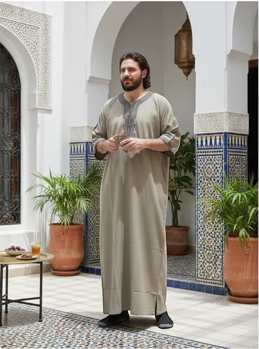 Khayr Thobes men's sand beige Moroccan thobe with grey embroidery on the neckline and cuffs. Relaxed fit, floor length.