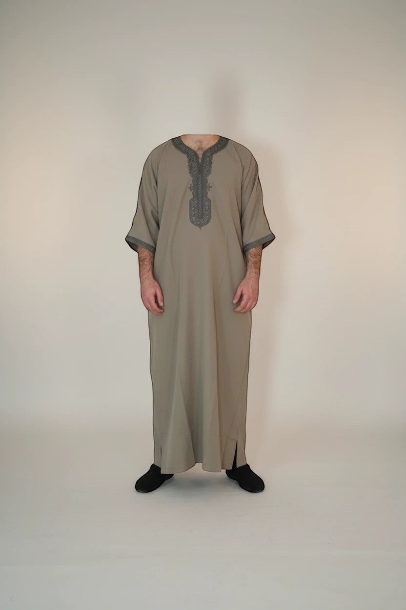 Khayr Thobes men's traditional thobe in neutral tone with grey embroidery on neckline and cuffs.