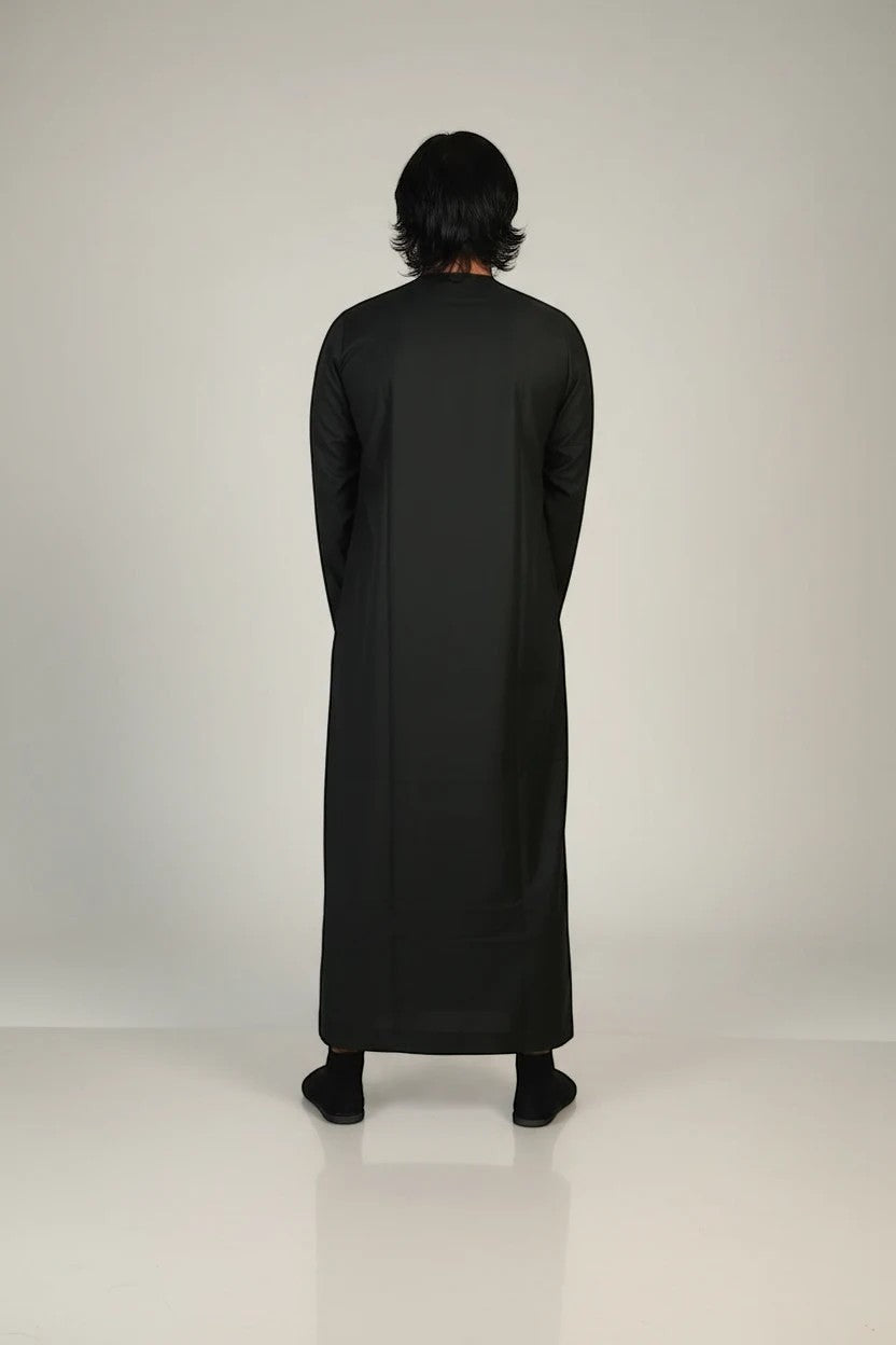 Khayr Thobes men's long sleeve thobe in forest green with gold trim and tassel detail.