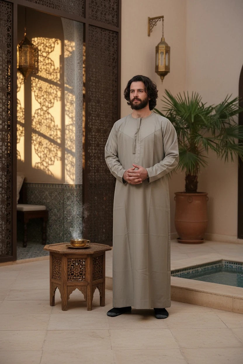 Khayr Thobes light grey traditional Islamic thobe robe with tassel detail on placket. Long sleeves, full length, modest fit.