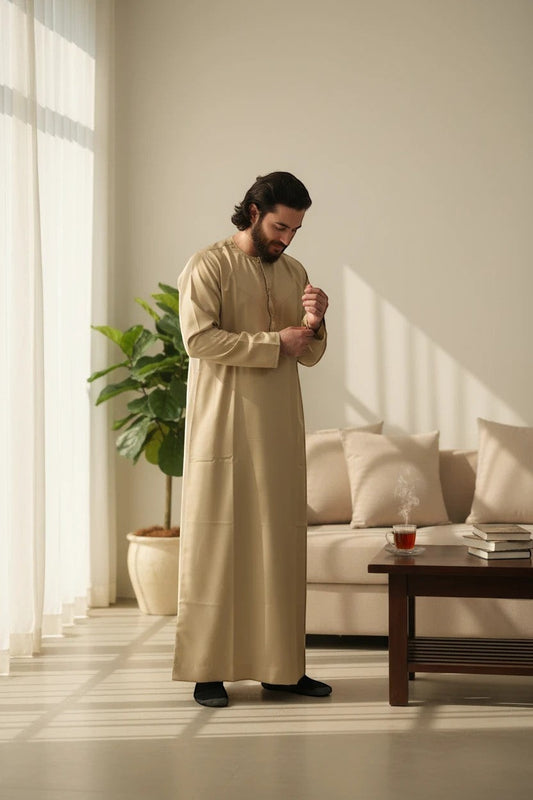 Khayr Thobes men's beige thobe robe with mandarin collar and side pocket, made from breathable fabric.