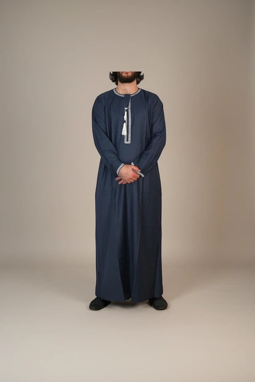 Khayr Thobes Men's traditional long sleeve thobe in deep navy with white tassel detail on neckline.
