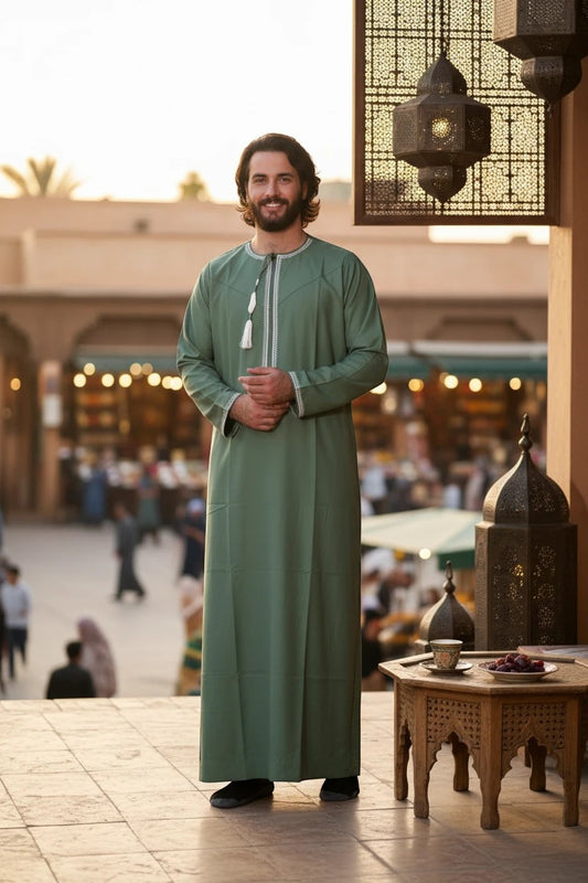 Khayr Thobes Men's sage green thobe robe with white embroidery and tassels on round neckline. Breathable fabric.