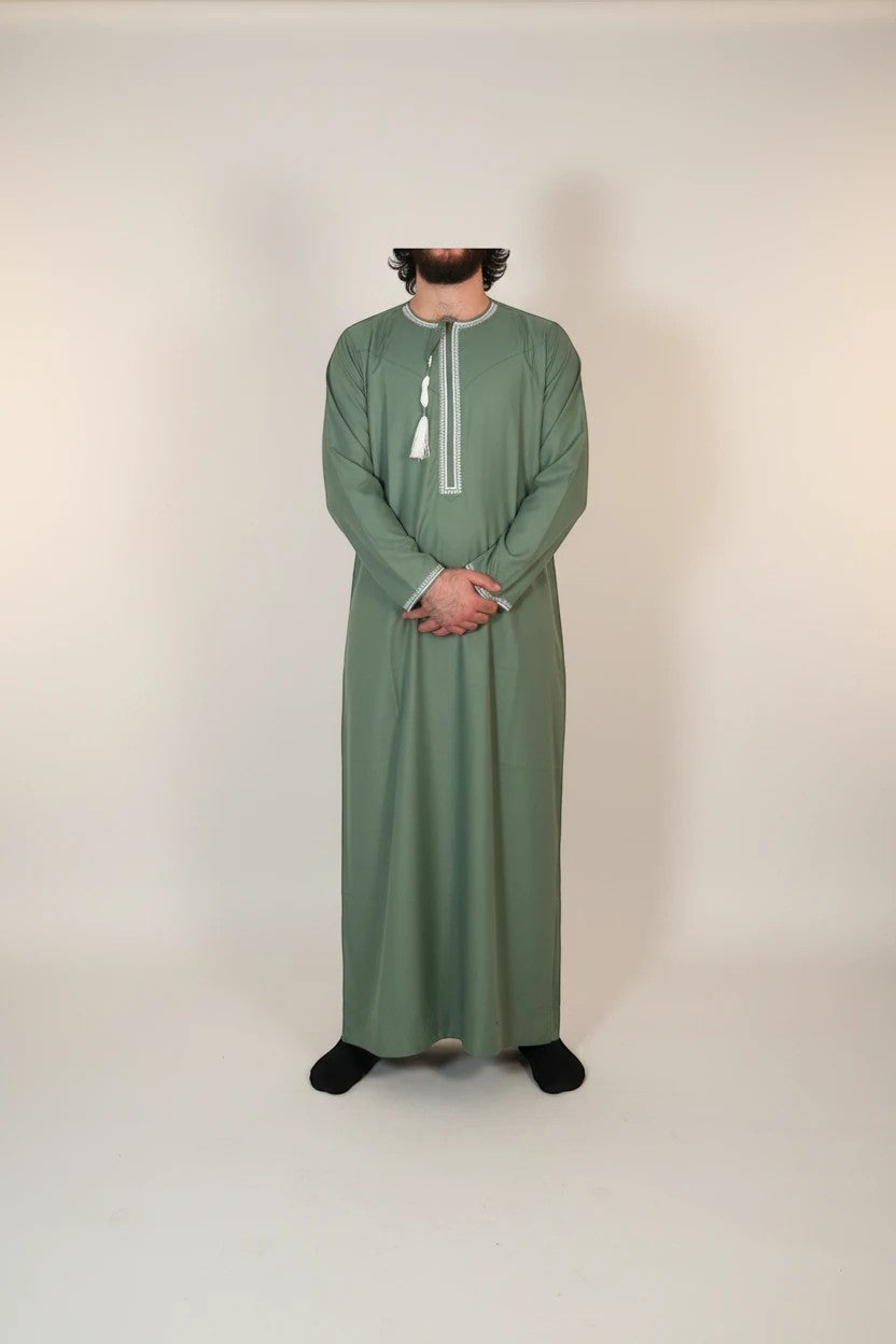 Khayr Thobes men's sage green thobe robe with white embroidery and tassels on round neckline. Long sleeves, full length.
