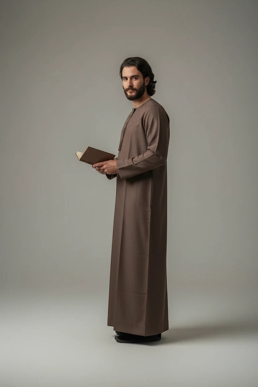 Khayr Thobes traditional brown long sleeve thobe with round neckline and subtle button detailing.