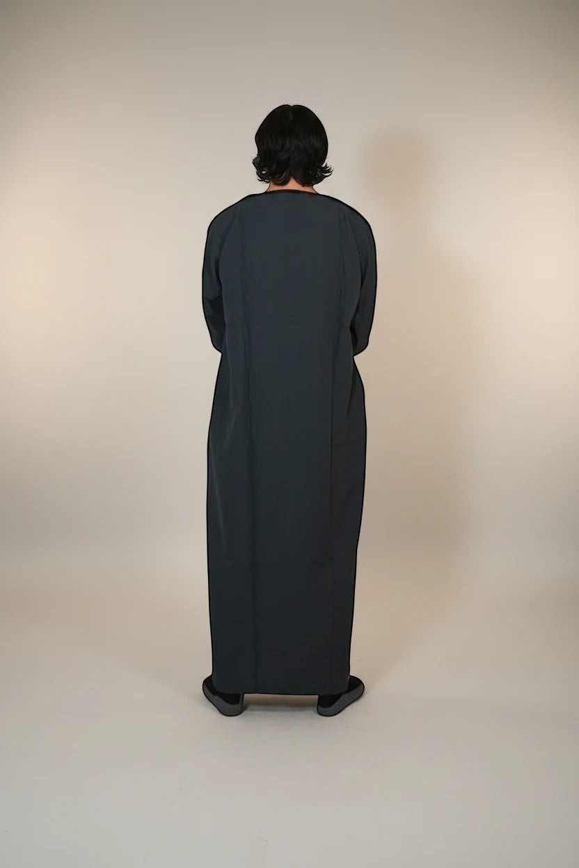 Khayr Thobes traditional embroidered thobe in charcoal grey, featuring black embroidery on the neckline and cuffs. Relaxed fit.