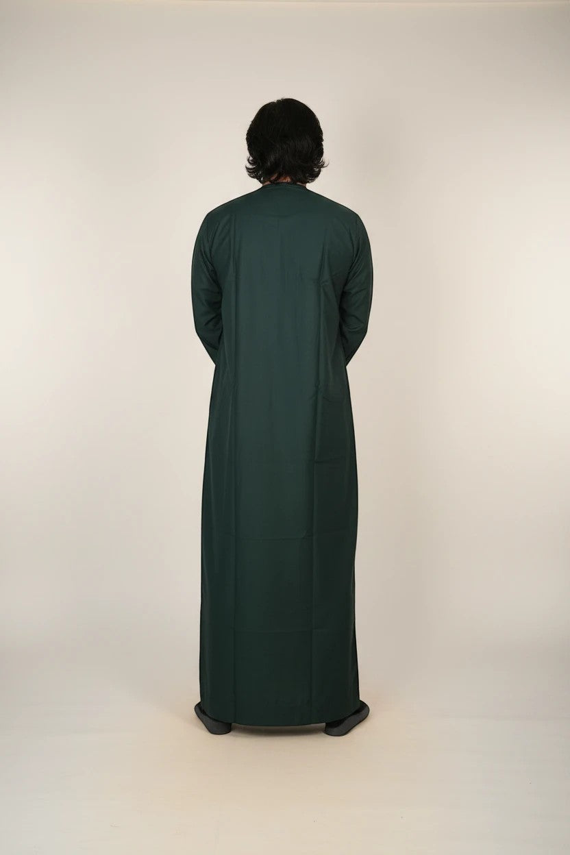 Khayr Thobes traditional Islamic thobe in deep forest green with white embroidery and tassel detail. Long sleeves, full length.