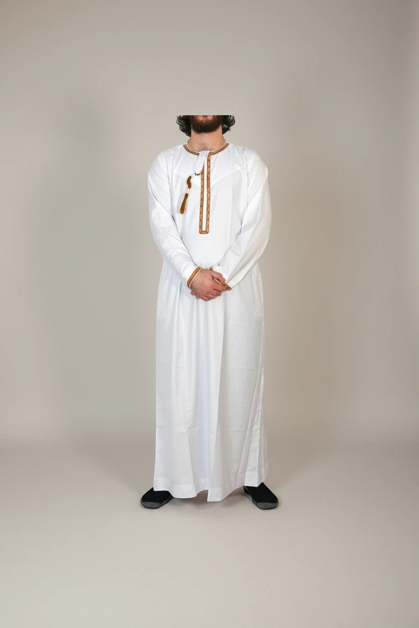 Khayr Thobes traditional white men's thobe with brown embroidered neckline and tassel detail.